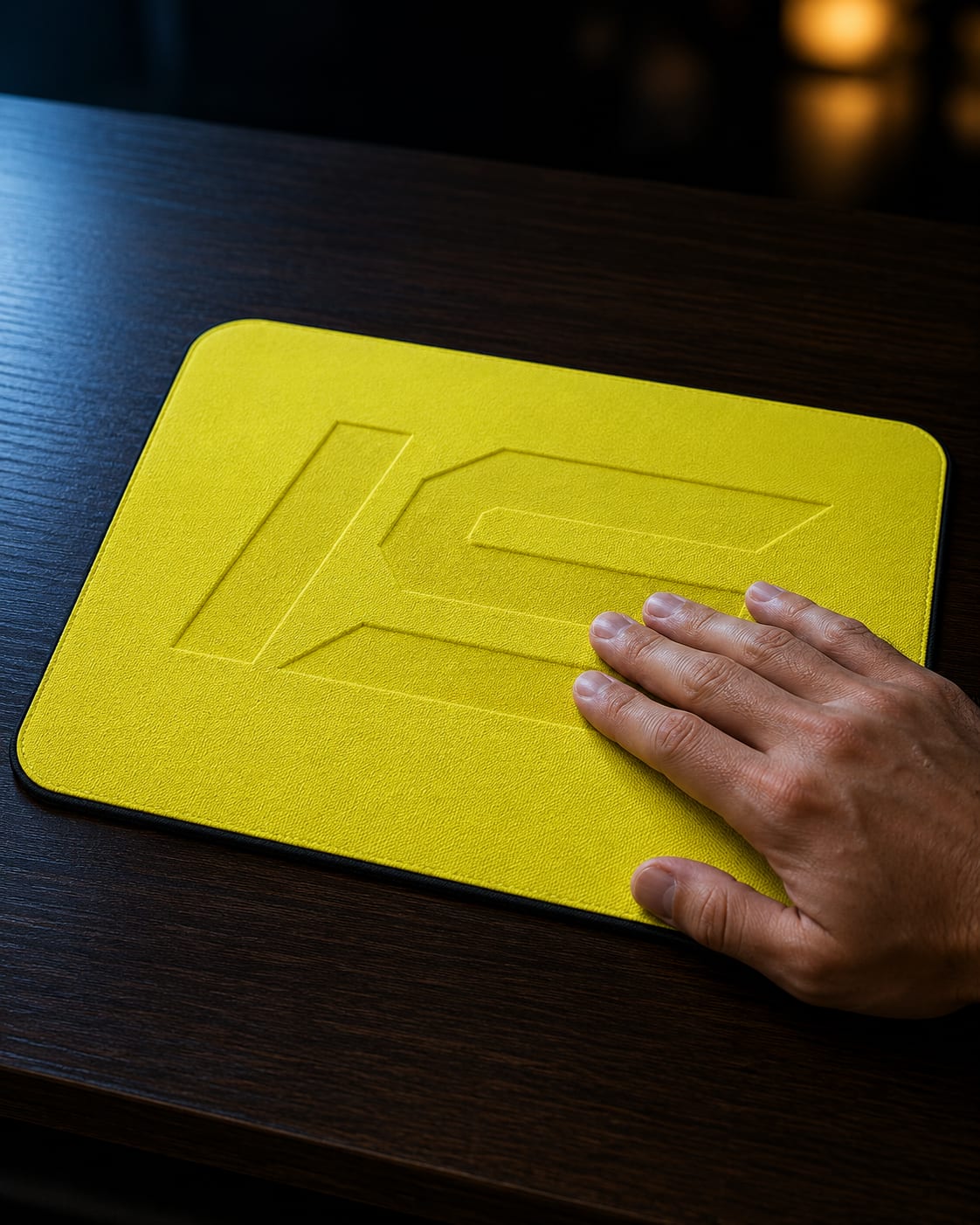 Iced Slatez fully flipped, chartreuse-yellow cooling side facing up, a hand pressed against it